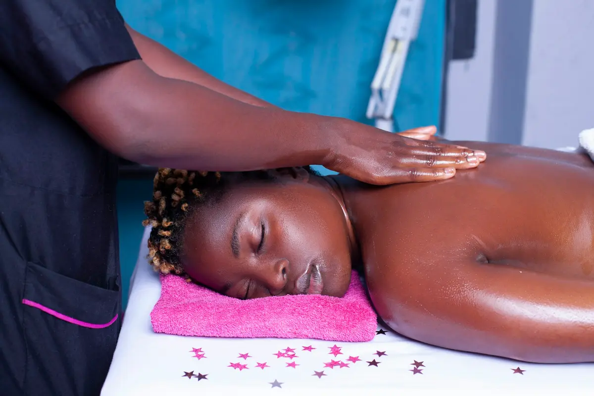 A massage therapist giving a relaxing back massage